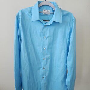 Calvin Klein.  Dress Shirts Size 32/33. Color: Light blue. NWT